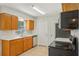 Classic kitchen showcasing wood cabinets, laminate countertops, and modern appliances at 384 Zinnia Dr, Casselberry, FL 32707
