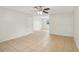 Bright living room with neutral walls, tile flooring, and a ceiling fan at 384 Zinnia Dr, Casselberry, FL 32707