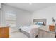 Cozy bedroom with neutral walls, twin bed, and dresser, creating a comfortable and inviting space at 392 Citrine Loop, Kissimmee, FL 34758