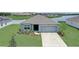 Charming single-Gathering home with a well-manicured lawn and attached two-car garage in a tranquil neighborhood at 392 Citrine Loop, Kissimmee, FL 34758