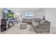 Comfortable living room with a plush sectional sofa, decorative fireplace, and ample natural light at 392 Citrine Loop, Kissimmee, FL 34758