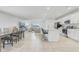 Open-concept living space with tile flooring, a kitchen island and a dining area at 392 Citrine Loop, Kissimmee, FL 34758