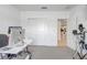 Bright home office with neutral carpet, with a closet and doorway at 392 Citrine Loop, Kissimmee, FL 34758