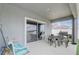 Covered patio with outdoor dining set and barbecue grill at 392 Citrine Loop, Kissimmee, FL 34758