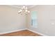 Dining room with modern light fixture and bright window at 4209 Barbuda Ln, Kissimmee, FL 34758