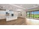 Open-concept kitchen and living area with modern finishes and abundant natural light at 4209 Barbuda Ln, Kissimmee, FL 34758