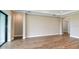 Spacious living room with wood floors and sliding glass doors to the outdoor area at 4209 Barbuda Ln, Kissimmee, FL 34758