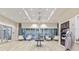 Well-lit lobby with hardwood floors, seating and front desk welcomes residents and guests at 4209 Barbuda Ln, Kissimmee, FL 34758