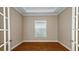 Home office featuring wood floors, natural light, and french doors at 4209 Barbuda Ln, Kissimmee, FL 34758
