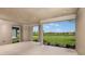 Covered patio with tranquil views of the pond and green space at 4209 Barbuda Ln, Kissimmee, FL 34758