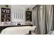 A luxurious spa room featuring soft lighting, custom shelving and storage, with a plush massage bed at 4209 Barbuda Ln, Kissimmee, FL 34758