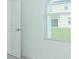 White wall with door and window in a modern bedroom at 491 Wayland Dr, Haines City, FL 33844