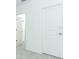 Bright hallway with an open doorway to an adjacent bathroom at 491 Wayland Dr, Haines City, FL 33844