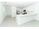 Spacious kitchen with stainless steel appliances, white cabinets, and quartz countertops with island and sink at 491 Wayland Dr, Haines City, FL 33844