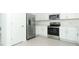 Modern kitchen with stainless steel appliances and white cabinetry at 491 Wayland Dr, Haines City, FL 33844