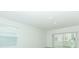 Bright living room featuring large windows and sliding glass doors at 491 Wayland Dr, Haines City, FL 33844