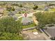 Aerial view of the home with surrounding mature trees and green lawns at 508 Churchill Pl, Poinciana, FL 34759