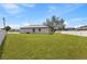 Large, grassy backyard offering ample space for outdoor activities and relaxation at 508 Churchill Pl, Poinciana, FL 34759