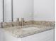 Granite vanity and sink with brushed nickel faucet, set in a bright new bathroom at 508 Churchill Pl, Poinciana, FL 34759