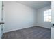 Bedroom features plush carpet, neutral walls, and a window providing natural light at 508 Churchill Pl, Poinciana, FL 34759