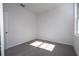 This carpeted bedroom is brightly lit by a window, plus it's freshly painted at 508 Churchill Pl, Poinciana, FL 34759