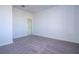 Spacious bedroom with carpet floors, white walls, and a white door at 508 Churchill Pl, Poinciana, FL 34759