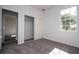 Cozy bedroom with plush carpeting, large window, and closet at 508 Churchill Pl, Poinciana, FL 34759