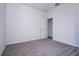A carpeted bedroom features neutral paint, and an open door to an adjacent space at 508 Churchill Pl, Poinciana, FL 34759