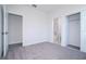 Carpeted bedroom with adjoining rooms at 508 Churchill Pl, Poinciana, FL 34759
