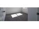 A carpeted bedroom is brightly lit by natural light, with light colored walls at 508 Churchill Pl, Poinciana, FL 34759
