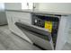 Close up of new stainless steel dishwasher with Energy Guide rating open in kitchen at 508 Churchill Pl, Poinciana, FL 34759
