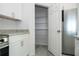 Kitchen featuring a stainless steel refrigerator, granite counters, and a walk-in pantry at 508 Churchill Pl, Poinciana, FL 34759
