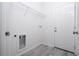 White laundry room with new washer/dryer hookups and shelving at 508 Churchill Pl, Poinciana, FL 34759