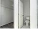 Walk-in closet with white wire shelving, next to a tiled toilet area at 508 Churchill Pl, Poinciana, FL 34759