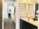 Bathroom with double sinks and a view into the corridor at 5273 Oakbourne Ave, Davenport, FL 33837