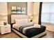 This bedroom features a queen-size bed, hardwood floors, and lots of natural light at 5273 Oakbourne Ave, Davenport, FL 33837