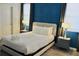 Stylish bedroom featuring a plush bed, elegant lighting, and contemporary accents for a relaxing space at 5273 Oakbourne Ave, Davenport, FL 33837