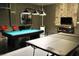 This game room features a pool table, ping pong table, and is perfect for entertaining at 5273 Oakbourne Ave, Davenport, FL 33837