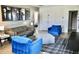 Living room features a comfortable sofa and chairs with cool movie posters at 5273 Oakbourne Ave, Davenport, FL 33837