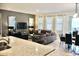 Open-concept living space featuring modern decor, a dining area, and plenty of natural light at 5273 Oakbourne Ave, Davenport, FL 33837