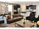 Spacious living room featuring modern furnishings and an open layout connecting to the kitchen at 5273 Oakbourne Ave, Davenport, FL 33837