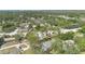 Aerial view of a home nestled among trees and lush greenery at 5505 W Magnolia Ave, Port Orange, FL 32127