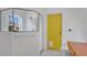 Bathroom featuring a walk-in shower with glass door and bright yellow door at 5505 W Magnolia Ave, Port Orange, FL 32127