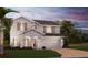 Charming two-story home with a brick driveway, two-car garage, and nicely landscaped front yard at 6014 Vision Rd, St Cloud, FL 34771