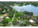 Breathtaking aerial shot of home near a lake, surrounded by green landscape. A true gem at 656 Lake Charm Dr, Oviedo, FL 32765