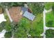 Aerial view of the home showcases a well-maintained yard and roof at 656 Lake Charm Dr, Oviedo, FL 32765