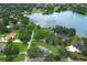 Picturesque aerial view of homes near a tranquil lake and lush greenery, showcasing a desirable lakeside community at 656 Lake Charm Dr, Oviedo, FL 32765