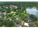 Aerial view of a lush community surrounding lakefront homes at 656 Lake Charm Dr, Oviedo, FL 32765
