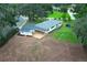 Stunning aerial view of home with a large yard, beautiful deck, and mature trees at 656 Lake Charm Dr, Oviedo, FL 32765