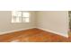 Light-filled bedroom boasts beautiful hardwood floors and fresh neutral paint at 656 Lake Charm Dr, Oviedo, FL 32765